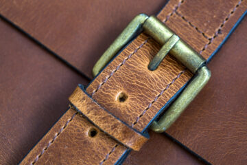 detail of a custom leather watch strap in production at a contract manufacturing facility